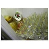 Shelf grouping yellow depression glass: wine