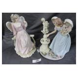 Two Winged angel figures in pink & blue