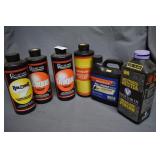 Five tins smokeless powder: Quarter full, Unique