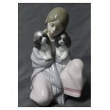 Lladro of girl with two puppies