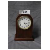 Dome top wood cased mantle clock with key