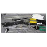 Assorted tools: pop rivet, flashlight, cleaning