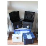 Four plastic document storage containers