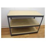 Three shelf metal cabinet with particle board shel