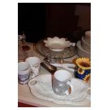 Kitchen grouping: cake plates, mugs, sunflower war