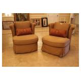 Pair of Neutral tan upholstered club chairs with r