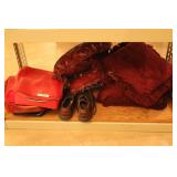 Makeup cases, red pillows (one with tear) & shoes