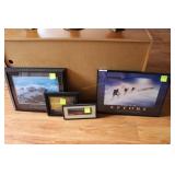 Four framed motivational posters