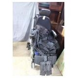 Q Edge power chair w/ tie downs, does not stay cha