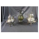 Three pitchers: Amber glass with face