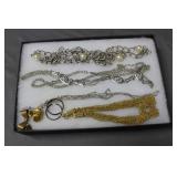 Four chunky costume necklaces with bow pendant