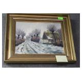 Framed Winter scene on canvas signed lower right