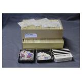 Two glassine organizers of stamps, Two plastic