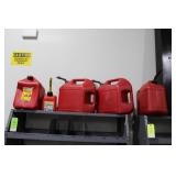 Five gas cans - 4x five gallon & 1x one gallon