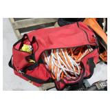 Oversized red bag with climbing belt, slings, acce