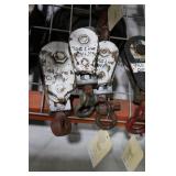 Three White framed steel pulleys on swivels