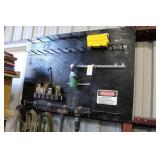 Wall board with cleaners, buffing wheel, sledge ha