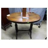 Walnut oval parlor tableHardwood base, 36 in
