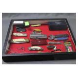 Knives (12); fishing lures (3); scissors - no