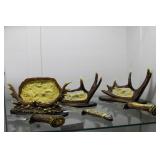 Three contemporary antler knives on stands
