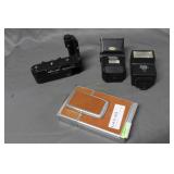 Poloroid, two flash & speed loader