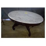 Parlor table w/ oval marble top, carving on