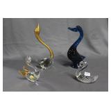 Four art glass swans - cobalt, gold beak and