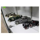 Six model cars, some with damage