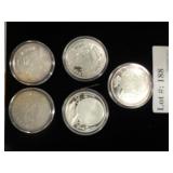 Five Disney Christmas silver rounds