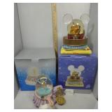 Two Disney snow globes - Tinkerbell on Mirror &