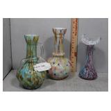 Three molded art glass vases - one with handle in