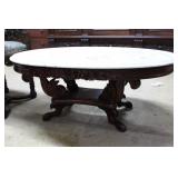 Oval top marble coffee table with carved mahogany
