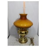 Brass table lamp with case glass amber shade