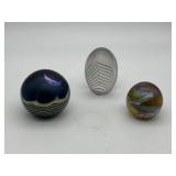 Three art glass paperweights