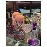 Five purple perfume bottles