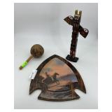 Arrowhead shaped wall art with scene, carved