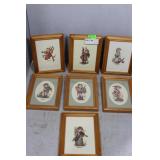 Seven framed miniature needlepoint Hummel figures
