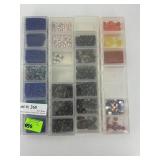 Four organizers of glass beads - blue, black,