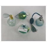 Four aqua perfume bottles