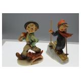 Two Hummel figures - boy on skis & boy with dog