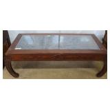 Asian high relief coffee table with glass top and