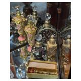 Five Perfume bottles with ornate metal filagree