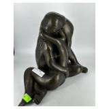 Cast plaster nude embracing couple statue