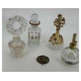 Four cut glass & metal stoppered perfume bottles