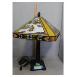 Lamp with Hummel themed glass shade