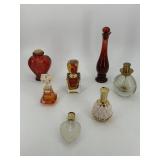 Seven amber colored perfume bottles