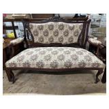 Parlor settee in floral pattern & mahogany frame
