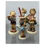 Four Goebel Hummel incl girl with cake, girl with