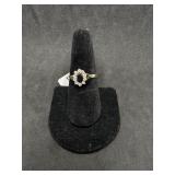 14kt Ring w/ oval black stone and ten small round