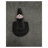 10kt Ring with baguette stones in purple hue, one